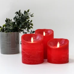 LED bloklys med bevægelig flamme, rød, 3 stk, Ø10cm, inkl. fjernbetjening og timer, højde varierende fra 10cm til 15cm, ægte stearin